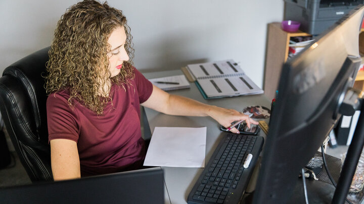 Female farmer working on a computer