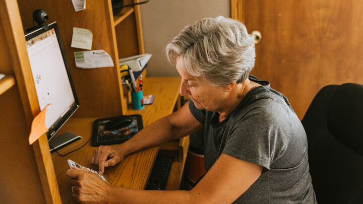 Female farmer working on a computer