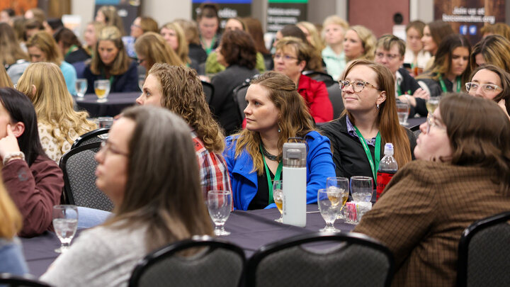 Attendees listen to a keynote presentation at the 2024 Nebraska Women in Agriculture Conference.