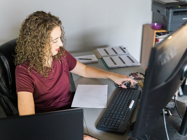 Female farmer working on a computer
